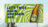 Eine Werbetafel für „Mountain Twister“ mit dem Slogan „Let’s twist again. And again. And...“ Das Design zeigt eine Flasche des Getränks vor einem auffälligen grünen, spiralförmigen Hintergrund.
